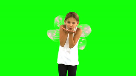 Little-girl-wearing-dragonfly-wings-on-green-screen