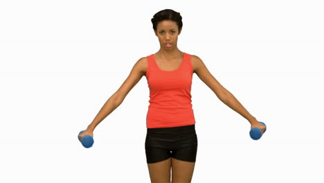 Pretty-woman-lifting-dumbbells-on-white-screen-in-slow-motion