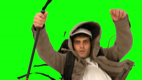 Man-with-a-hiking-stick-running-on-green-screen