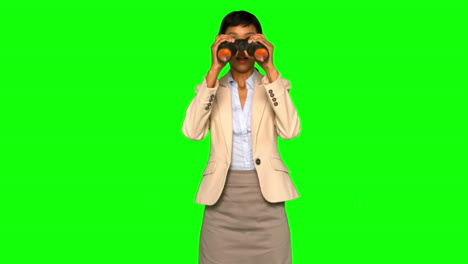 Astonished-businesswoman-using-binoculars