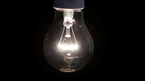 Focus-on-lit-filament-light-bulb