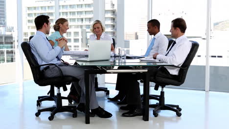 Business-team-talking-around-a-desk
