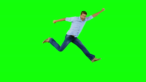 Man-jumping-and-gesturing-on-green-screen