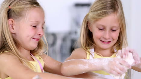 Twin-sisters-making-dough-for-cake