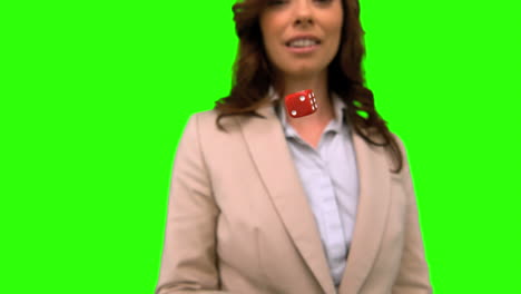 Businesswoman-throwing-a-die-on-green-screen