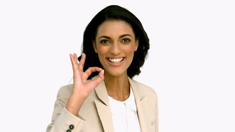 Businesswoman-giving-ok-sign