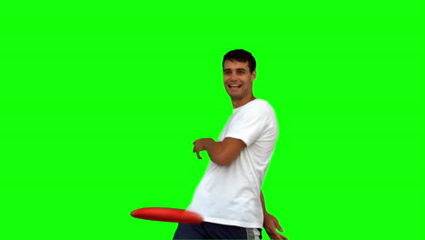 Man-throwing-a-frisbee-on-green-screen