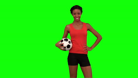Mujer-Atrapando-Una-Pelota-De-Fútbol-En-Pantalla-Verde
