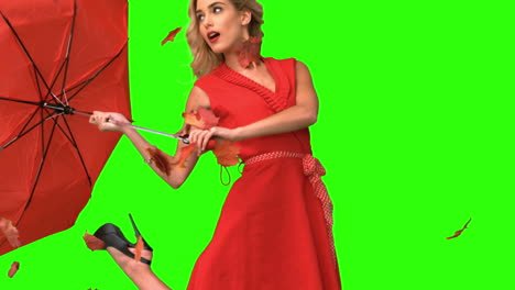 Pretty-woman-holding-a-broken-umbrella-on-green-screen