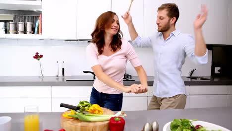 Couple-dancing-and-acting-silly-in-the-kitchen