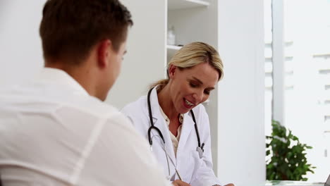 Female-doctor-talking-to-a-patient-