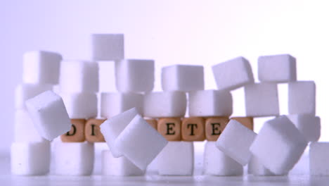Wall-of-sugar-cubes-with-dice-spelling-out-diabetes
