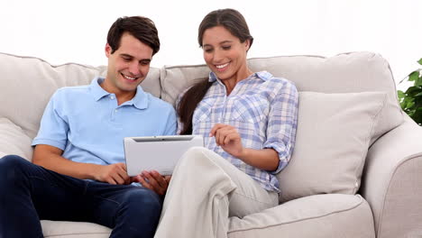 Young-couple-using-tablet