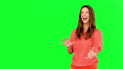 Smiling-woman-catching-a-basket-ball-on-green-screen