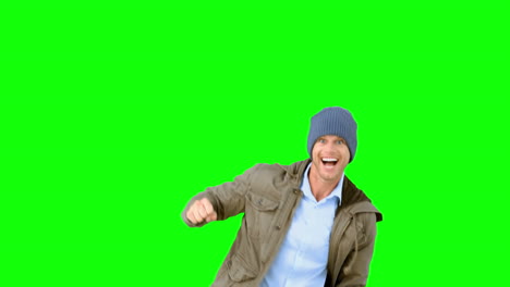 Man-jumping-and-turning-on-green-screen