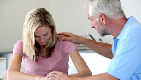 Sad-woman-being-comforted-by-her-husband