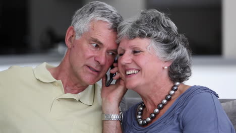 Mature-couple-having-a-phone-conversation-