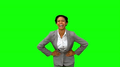 Attractive-businesswoman-laughing-on-green-screen-