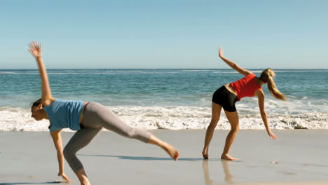 Attractive-women-doing-cartwheels-in-front-of-the-sea
