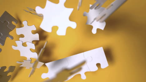 Jigsaw-puzzle-falling-on-orange-surface