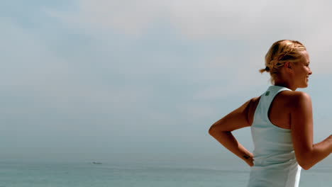 Sportswoman-jogging-across-the-beach