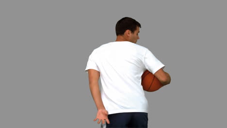 Mann-Dribbelt-Mit-Einem-Basketball-Auf-Grauem-Bildschirm