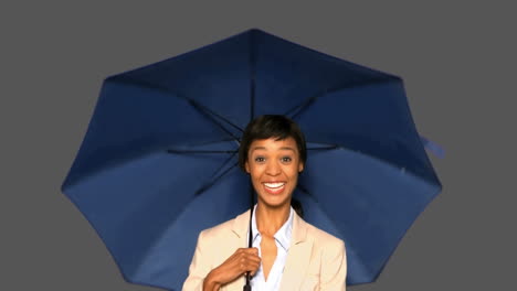 Happy-businesswoman-with-umbrella-