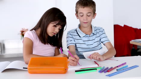 Two-children-colouring-together