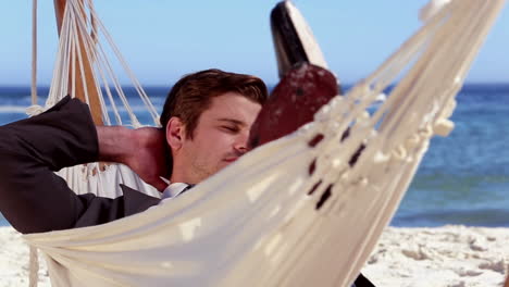 Businessman-relaxing-in-a-hammock