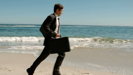 Businessman-running-on-the-beach