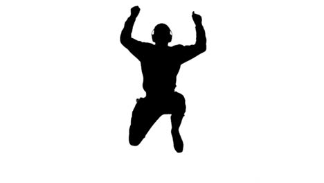 Silhouette-of-a-man-enjoying-music-and-jumping-on-white-background