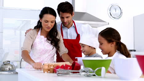 Family-preparing-cake-together