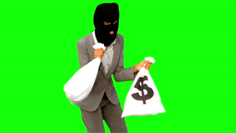 Ladrón-Sosteniendo-Bolsas-De-Dinero-En-Pantalla-Verde