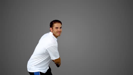 Attractive-man-playing-tennis-on-grey-screen