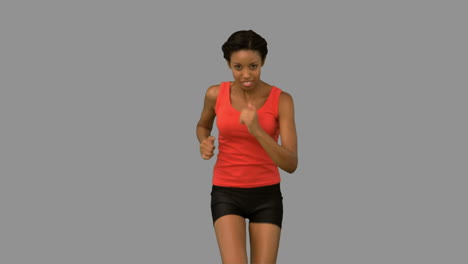 Woman-jogging-on-grey-screen