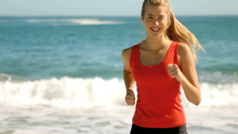 Woman-jogging-on-the-beach-