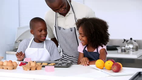 Father-and-children-eating-homemade-cookies