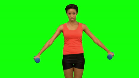 Pretty-woman-lifting-dumbbells-on-green-screen
