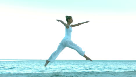 Attractive-woman-dancing-on-the-beach