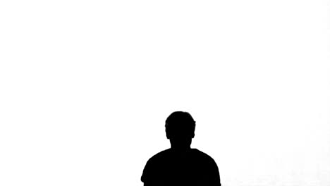 Silhouette-of-a-man-jumping-with-raised-arms-on-white-background