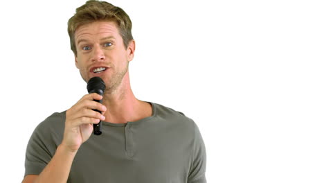 Man-with-microphone-singing-on-white-background