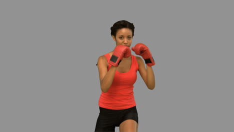 Woman-boxing-on-grey-screen-