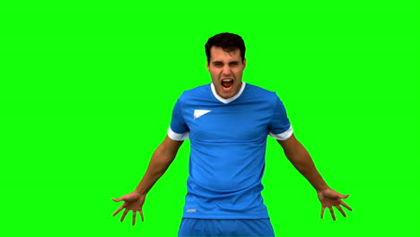 Angry-football-player-holding-his-head-on-green-screen