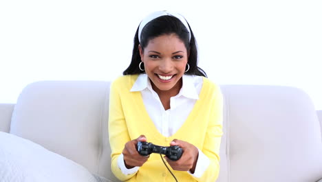 Woman-playing-video-games-on-sofa