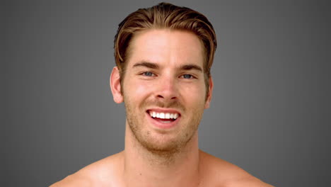 Man-showing-his-happiness-on-grey-background