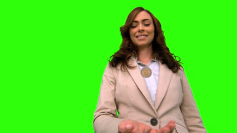 Businesswoman-throwing-a-coin-in-the-air-on-green-screen