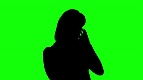Silhouette-of-woman-enjoying-music-on-green-screen