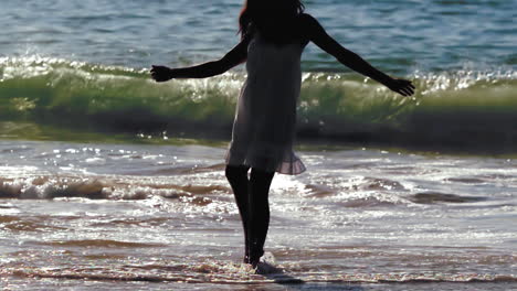 Silhouette-of-woman-revolving-in-waves
