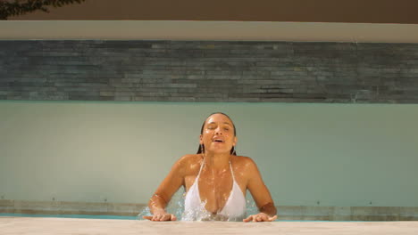 Woman-getting-out-of-swimming-pool