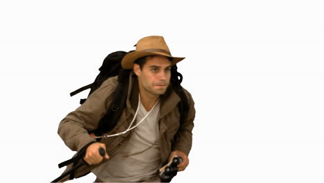 Man-orienteering-while-holding-a-hiking-stick-on-white-screen